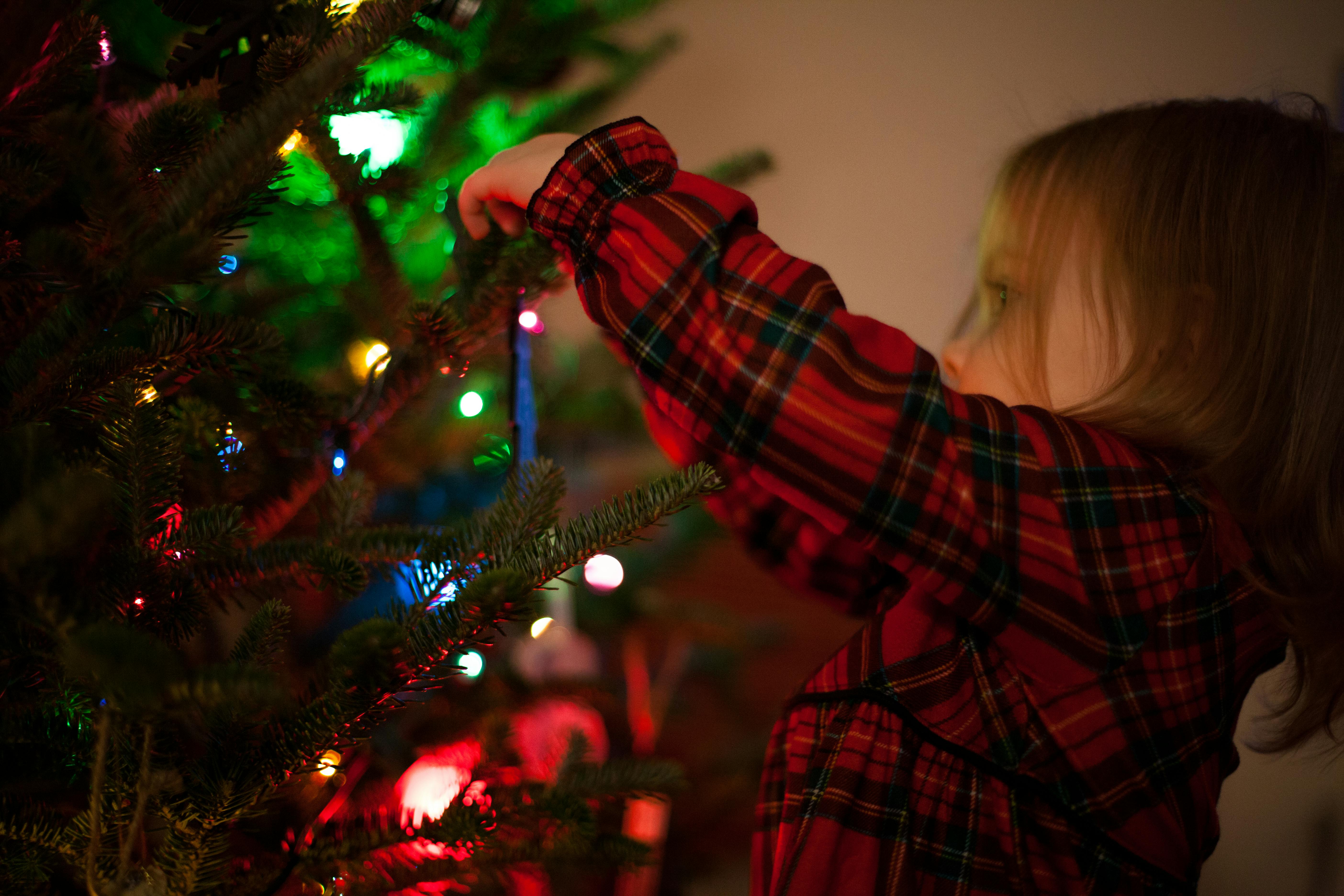 Christmas activities for children decorating a tree in a school or club